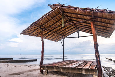 Built structure on beach against sky