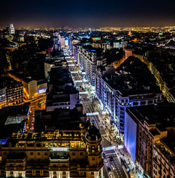 High angle view of illuminated buildings in city at night