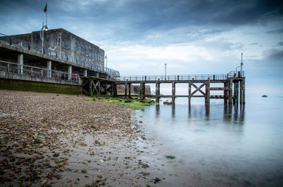 Pier over sea against sky