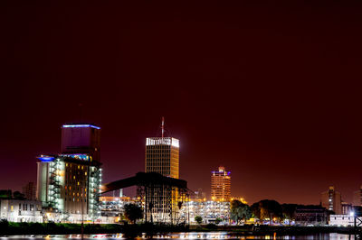 Illuminated buildings in city at night