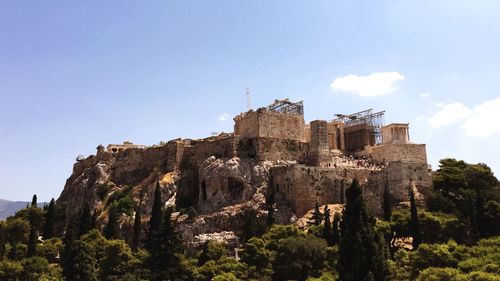 Acropolis of athens against sky on sunny day