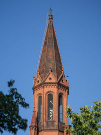 Low angle view of emmaus church against sky, berlin