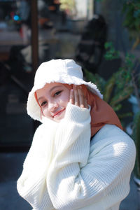 Portrait of smiling woman in snow