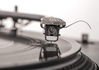 Old dusty vinyl turntable player isolated over white background