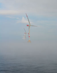 Wind farm offshore energy wind turbine construction on the north sea