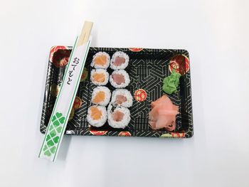 High angle view of sushi over white background