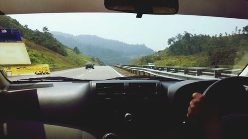 Cropped image of train on road