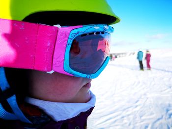 Close-up of child in snow