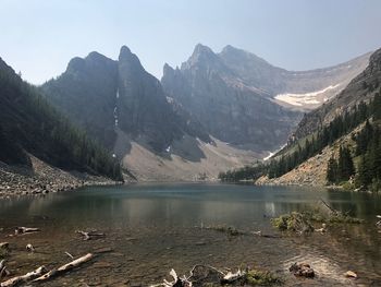 Scenic view of lake and mountains against clear sky