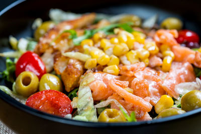 Close-up of salmon salad in bowl on table