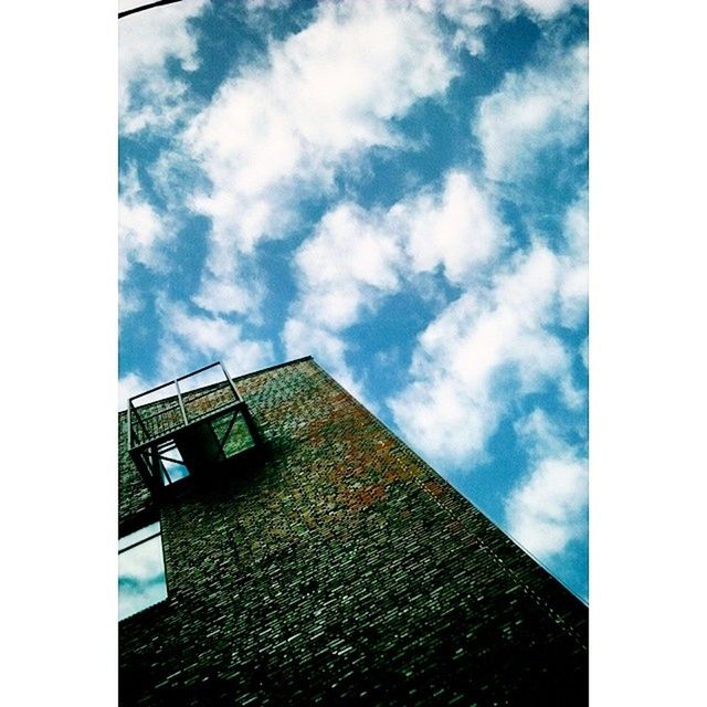 architecture, built structure, building exterior, sky, transfer print, low angle view, cloud - sky, auto post production filter, cloud, building, window, cloudy, day, residential structure, city, outdoors, no people, house, residential building, glass - material