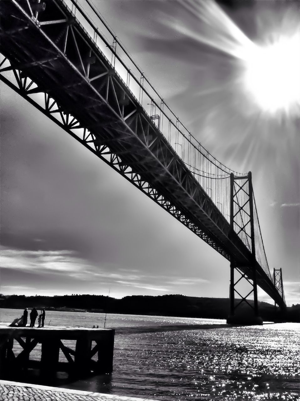 water, sky, sun, sea, silhouette, bridge - man made structure, connection, sunset, tranquility, sunlight, nature, cloud - sky, sunbeam, built structure, tranquil scene, scenics, beauty in nature, pier, low angle view, engineering