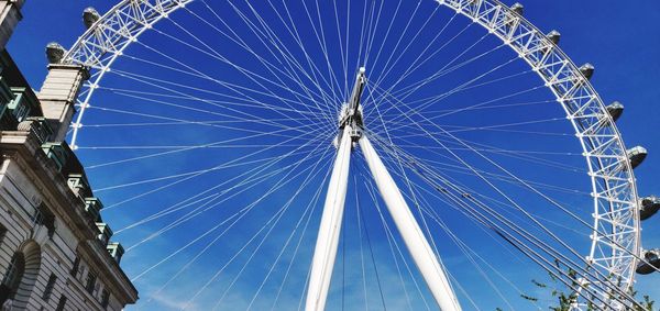 Low angle view of ferris wheel against sky