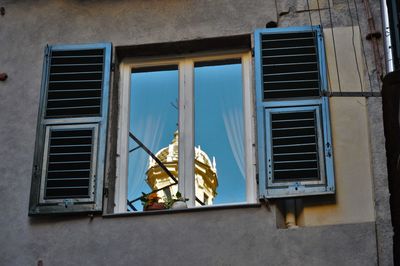 Reflection of building on window