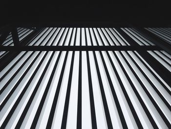 Low angle view of metal bars of fence