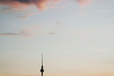 Silhouette fernsehturm against sky during sunset