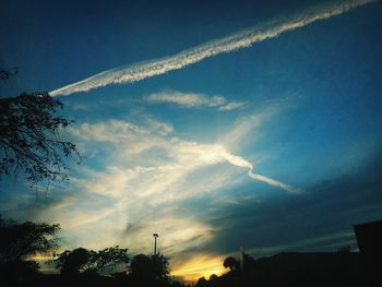 Low angle view of vapor trails in sky