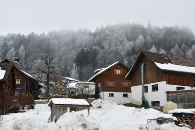 House on snow covered landscape