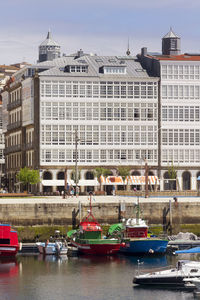 View of boats moored in city