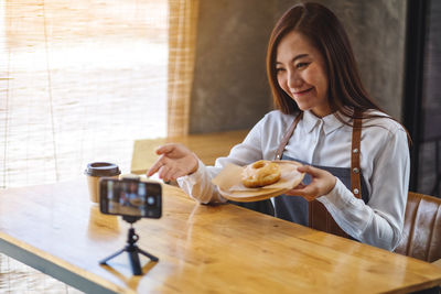 Portrait of woman using mobile phone