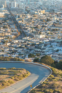 High angle view of road by buildings in city