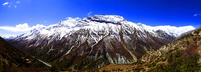 Panorama of mountains and snow in the himalayas trekking along annapurna circuit in nepal.