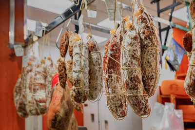 Close-up of meat hanging in store