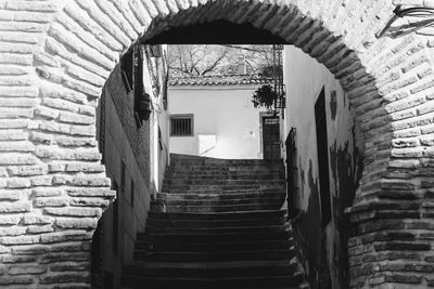 Staircase leading to wall of building