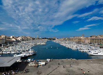 High angle view of boats moored at harbor