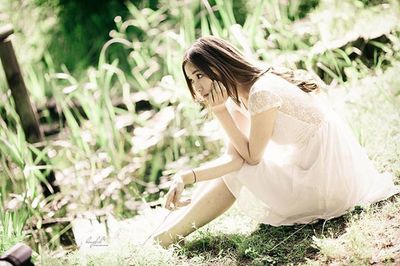 Woman standing on grass