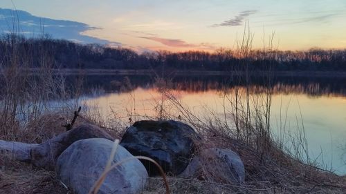 Scenic view of lake against sky during sunset