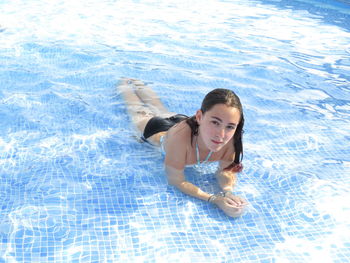 High angle view of woman swimming in pool