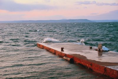 Scenic view of sea against sky during sunset