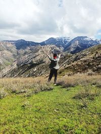 Full length of man on mountain against sky