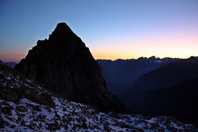 Mountains against sky during sunset in winter