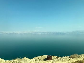 Scenic view of sea against blue sky