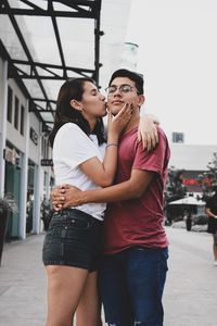 Young couple standing in city