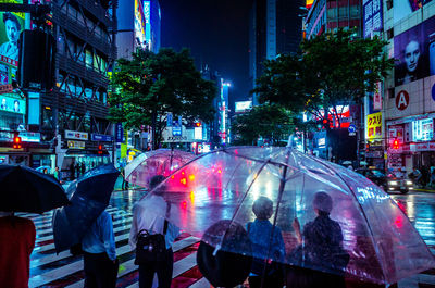 Crowd on city street at night