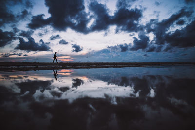 Scenic view of sea against sky at sunset