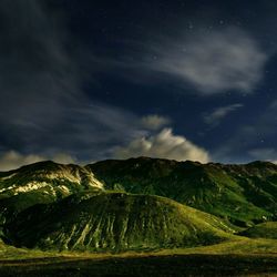 Scenic view of landscape against sky at night