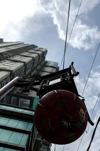Low angle view of building against cloudy sky