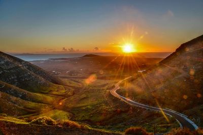 Scenic view of landscape against sky during sunset in lanzarote