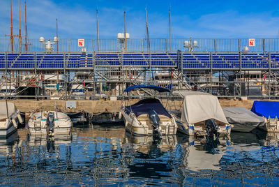 Boats moored at harbor