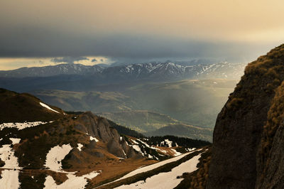 Spring landscape with snowy mountains, ciucas, transylvania, romania