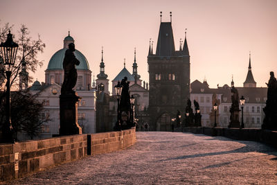 Statue of cathedral at sunset