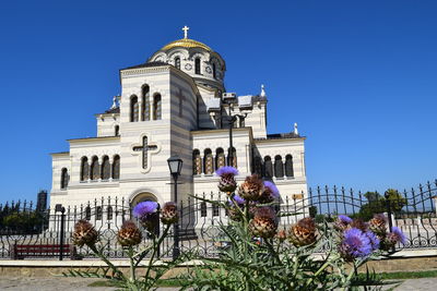 Low angle view of building against clear blue sky
