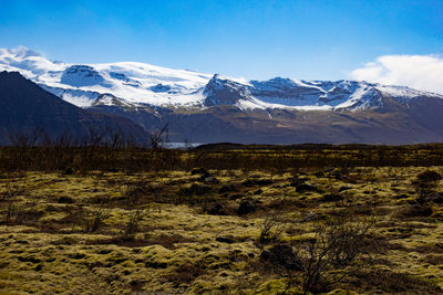 Scenic view of snowcapped mountains against sky