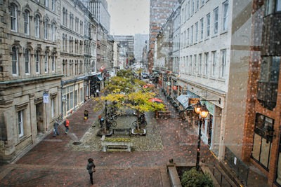 High angle view of street amidst buildings in city