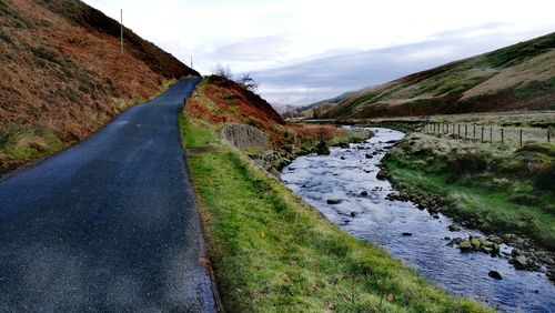 Road amidst landscape against sky