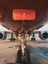 Airplane on airport runway against the sky